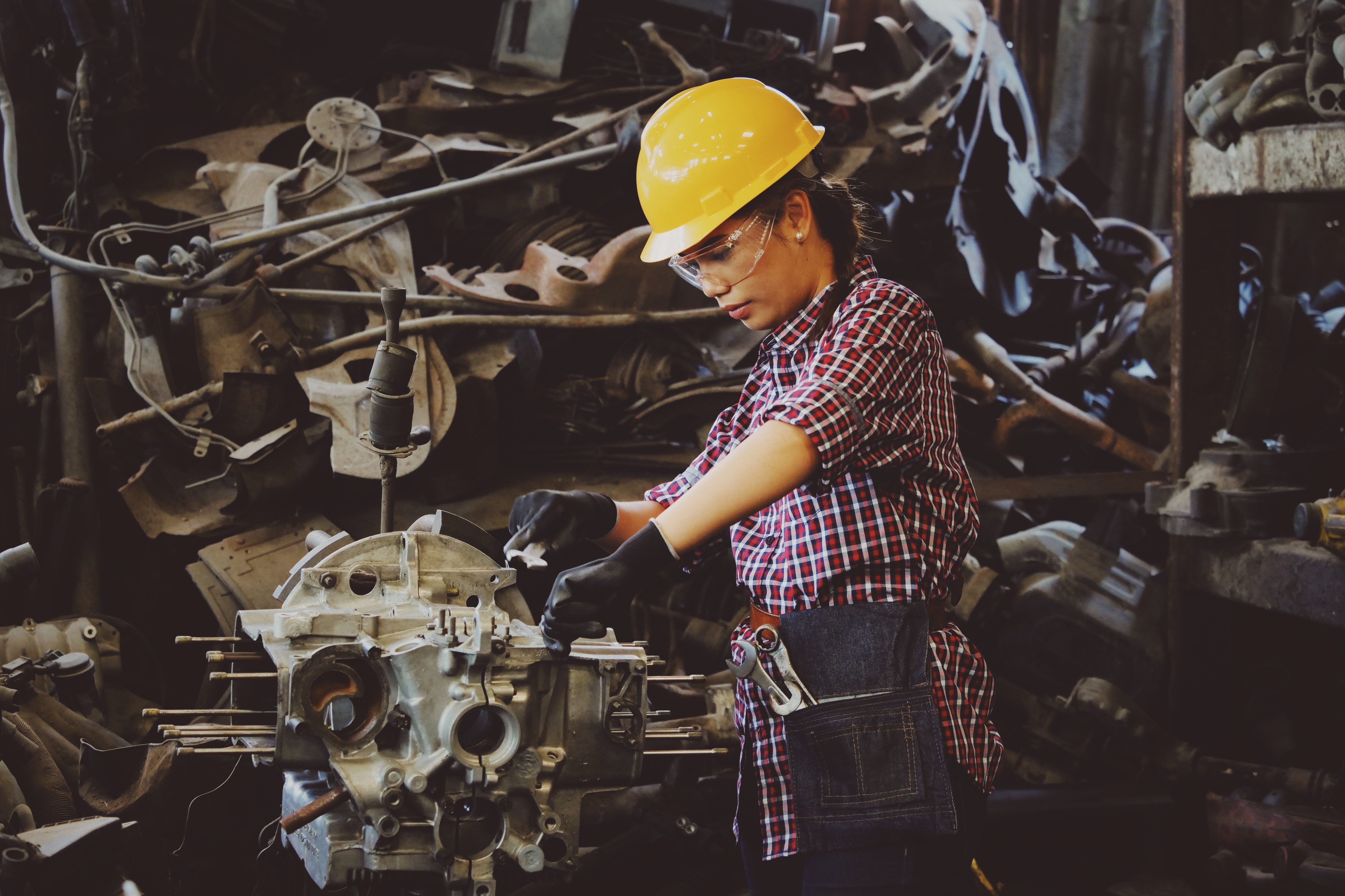 Woman Working on Engine