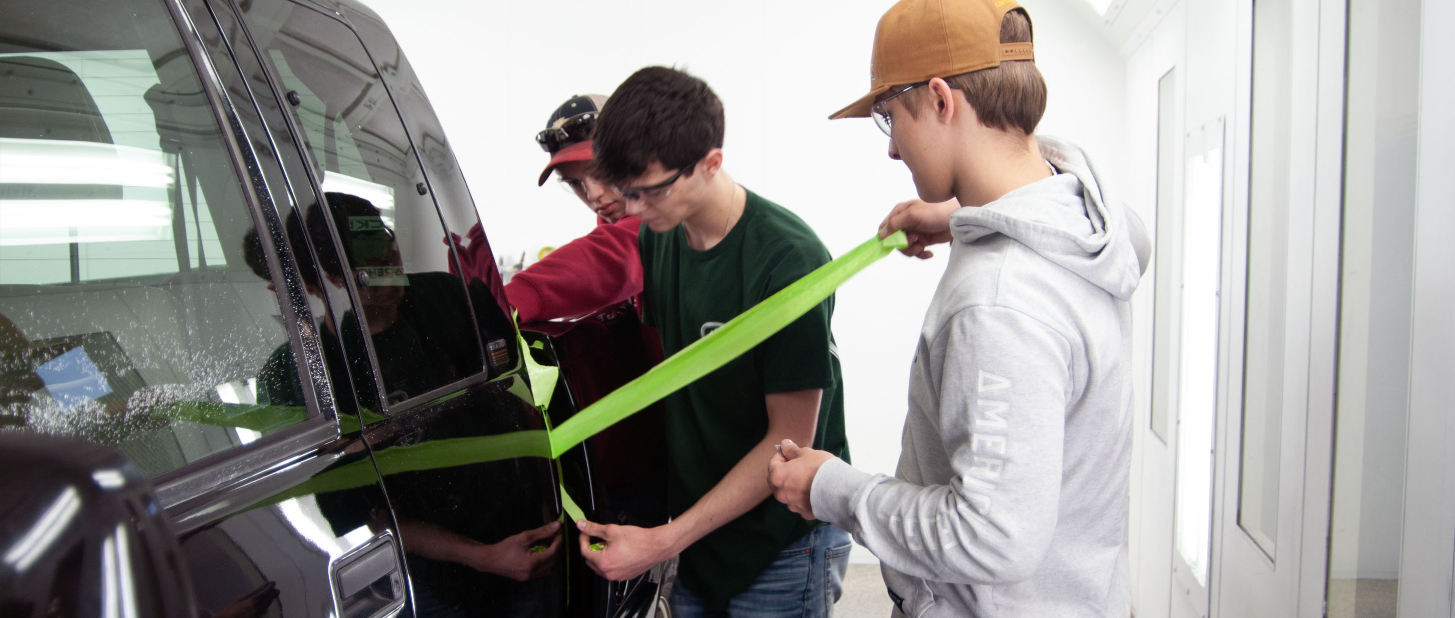 Students taping truck