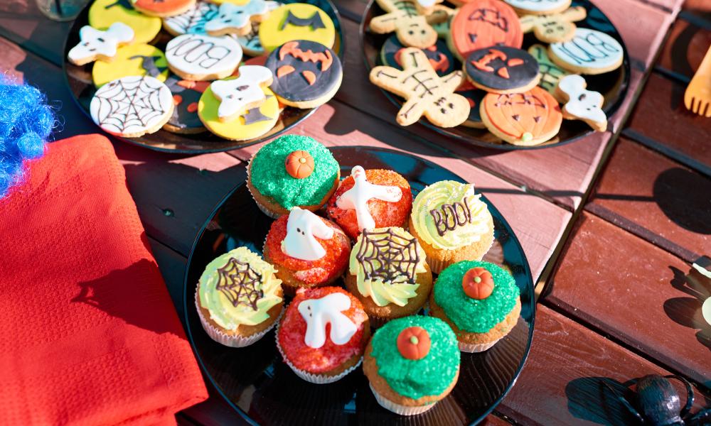 Collection of decorated cookies and cupcakes