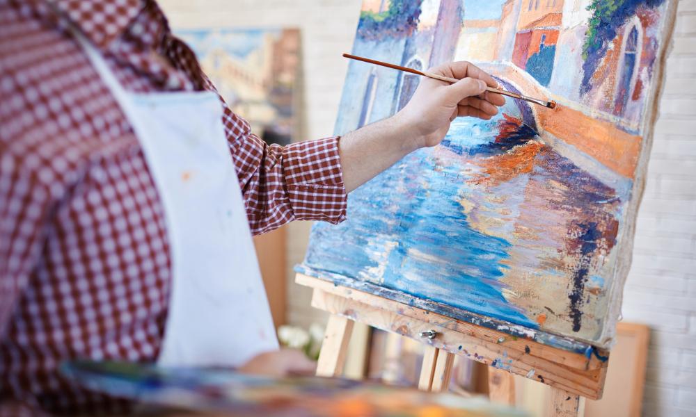 Artist painting on a canvas
