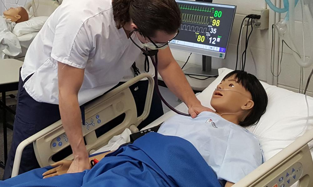 Photo of Nursing Student Listening to a Heart Beat
