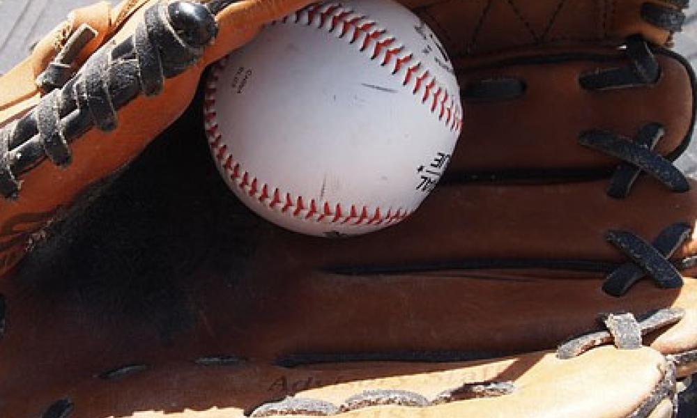 Photo of baseball sitting in glove
