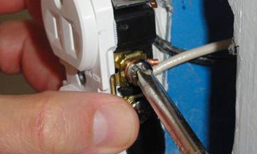 Photo of a Light Switch Being Installed
