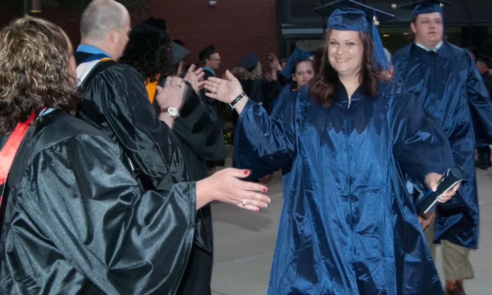 Student Walking Through Graduation Line