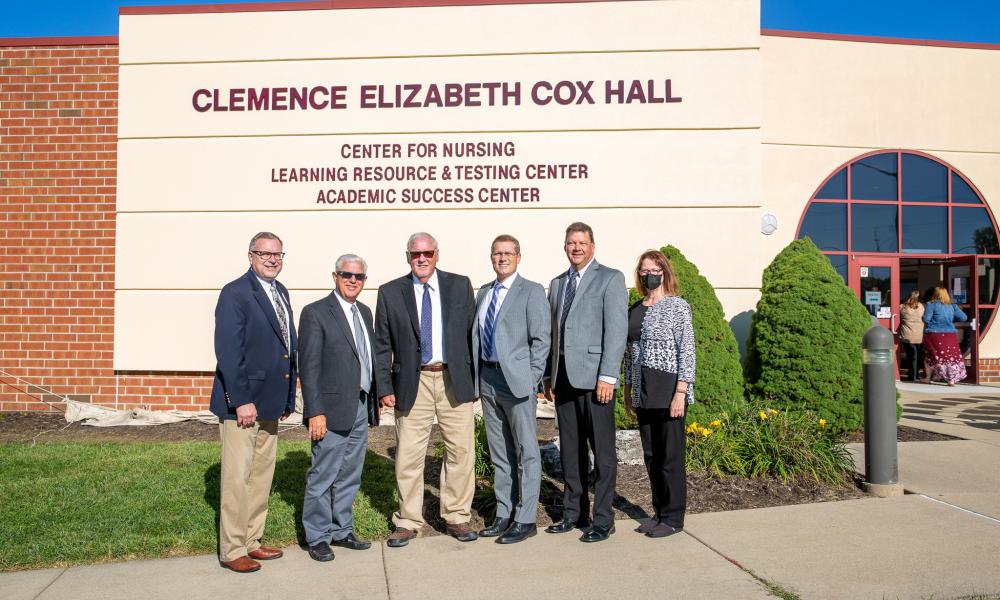 Jay Edgren, Gary Carter, Jerry Cox, Ryan Gower, Jan Ridgely, and Barbara Shimer pose in front of Clemence Elizabeth Cox Hall