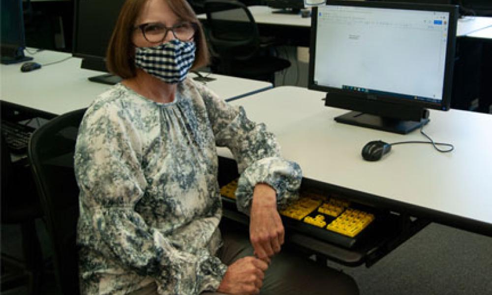 Jane McCormick Sitting at Computer