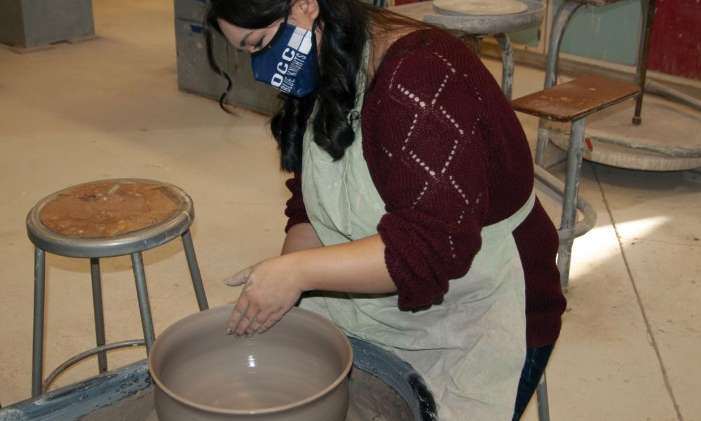 Photo of Mari Working on the Potter's Wheel