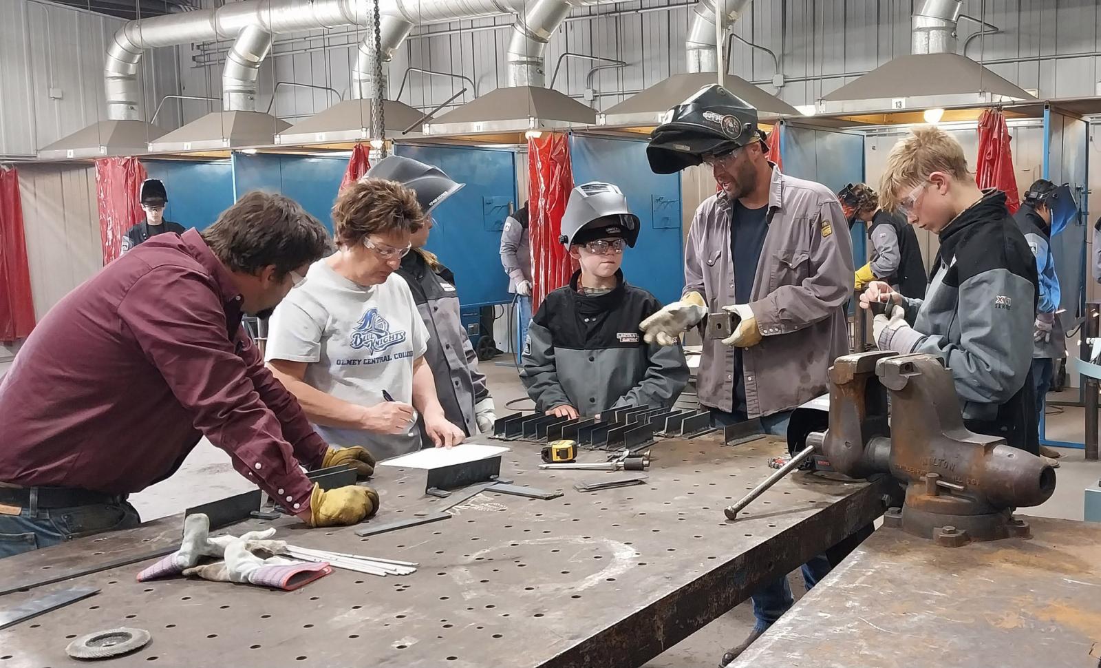 Photo of students welding in summer camp