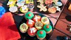 Assortment of decorated cookies and cupcakes
