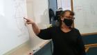 Photo of Instructor Lisa Benson at the white board
