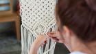 Person working on macrame project