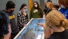 Students studying anatomy on Anatomage table