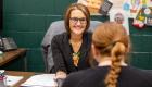 Krystle Riggle helps a student in a financial aid appointment.